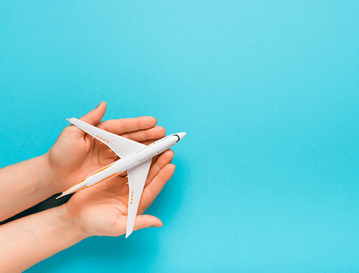 hands holding airplane toy hands holding airplane toy