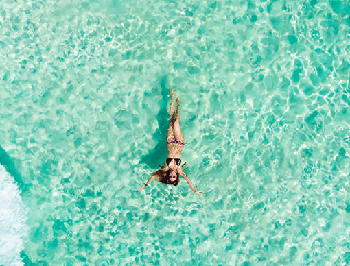person floating in water person floating in water