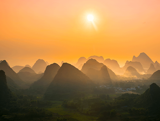 Sunset over dark mountains