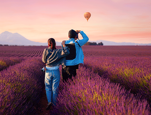 Two people walking in a field Two people walking in a field